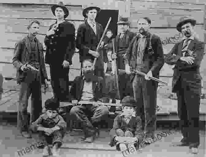 An Image Of Two Men, One From The Hatfield Family And One From The McCoy Family, Standing Face To Face With Guns In Their Hands. The Image Is Black And White And Has A Gritty, Vintage Look. The Feud: The Hatfields And McCoys: The True Story